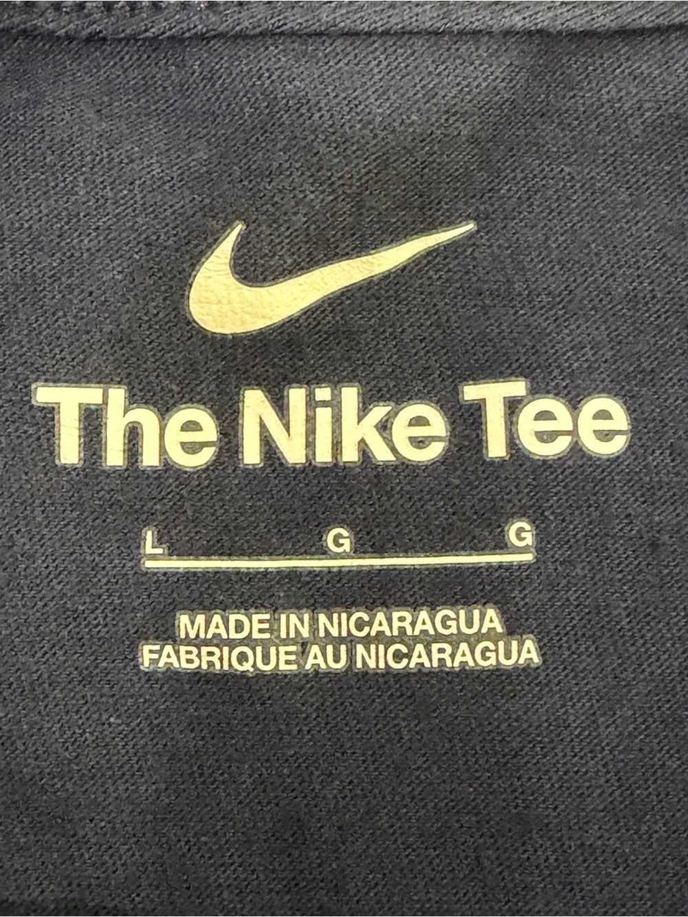 Nike Navy Short-Sleeve Tee with White Swoosh.